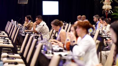 A group of people sitting at a conference table.